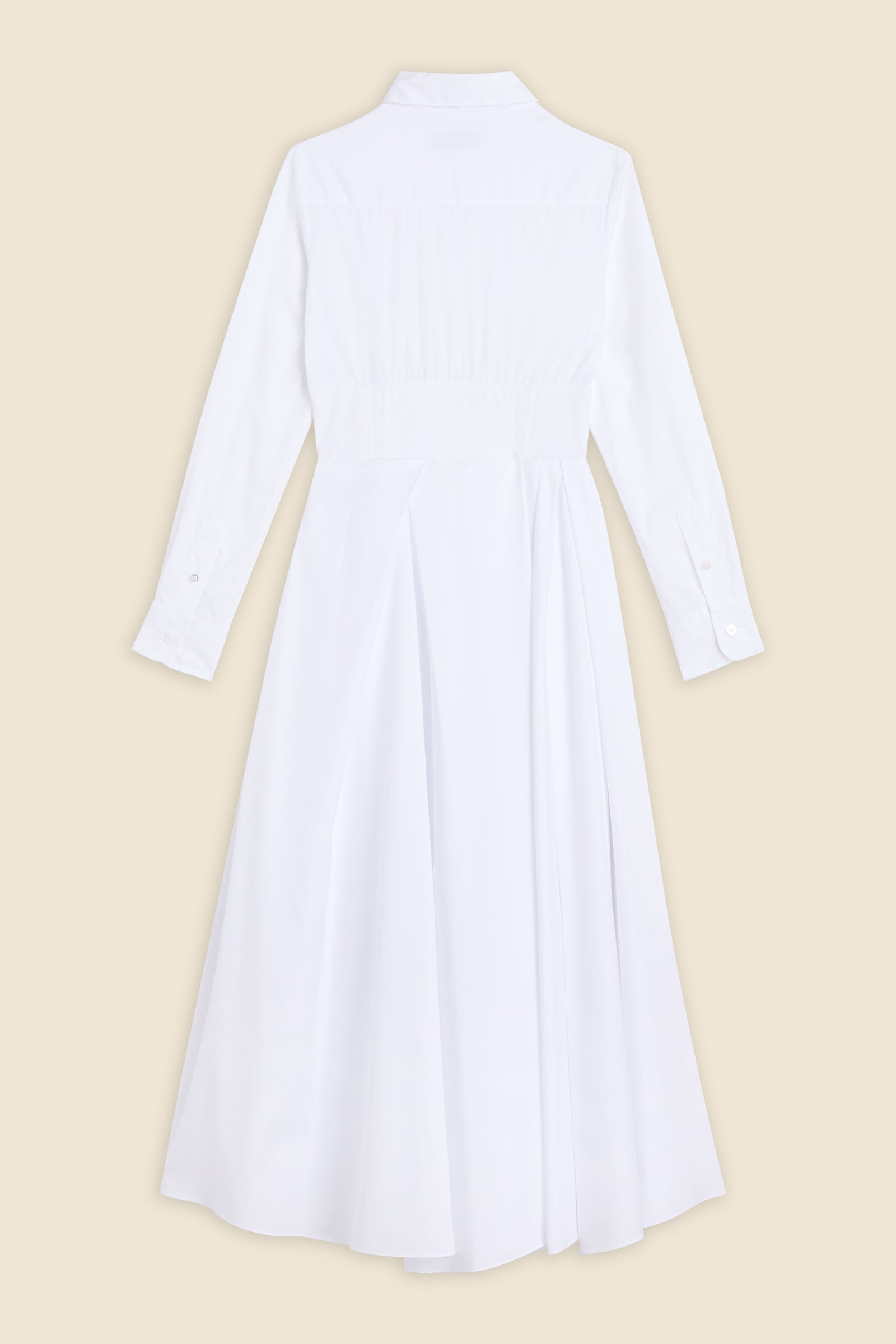 The meticulously placed pleats and poplin define the elegance of the dress, reflecting classic haute couture craftsmanship with a modern edge