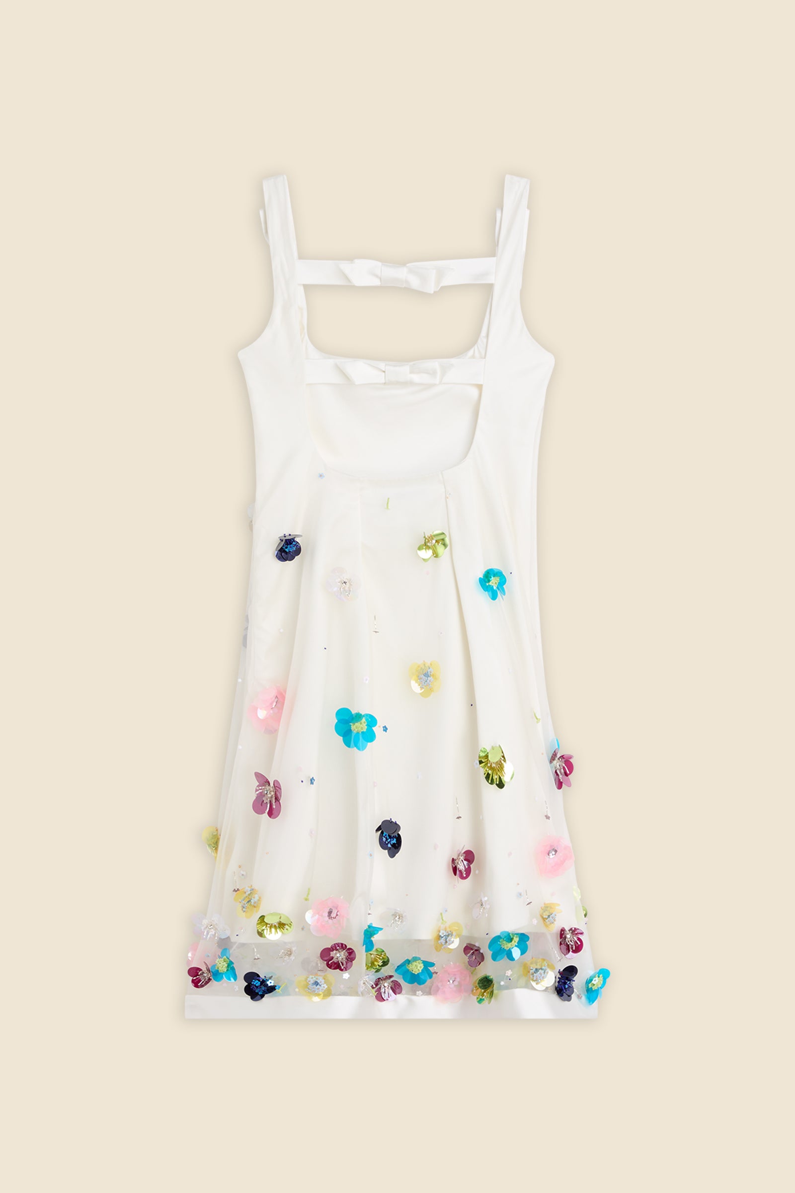 With hand-applied paillettes and crystals on silk organza featuring the satin edges, the dress transforms classic floral embroidery into a modern piece