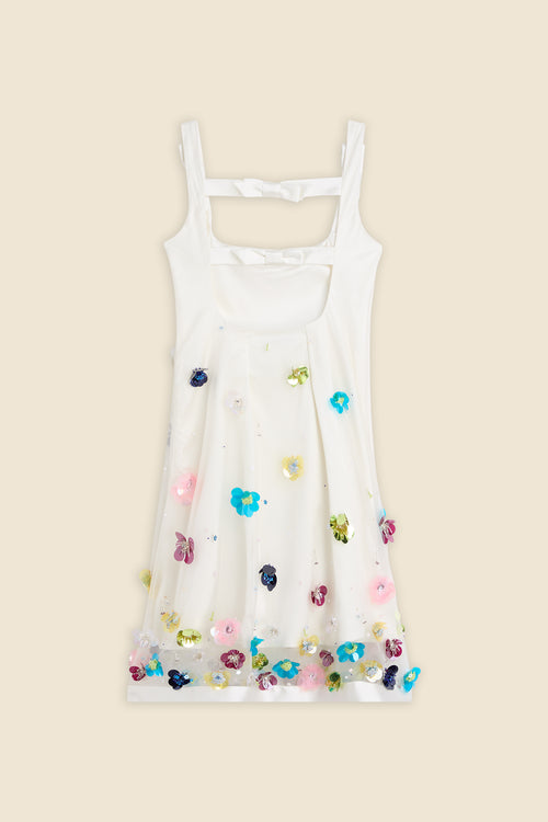 With hand-applied paillettes and crystals on silk organza featuring the satin edges, the dress transforms classic floral embroidery into a modern piece