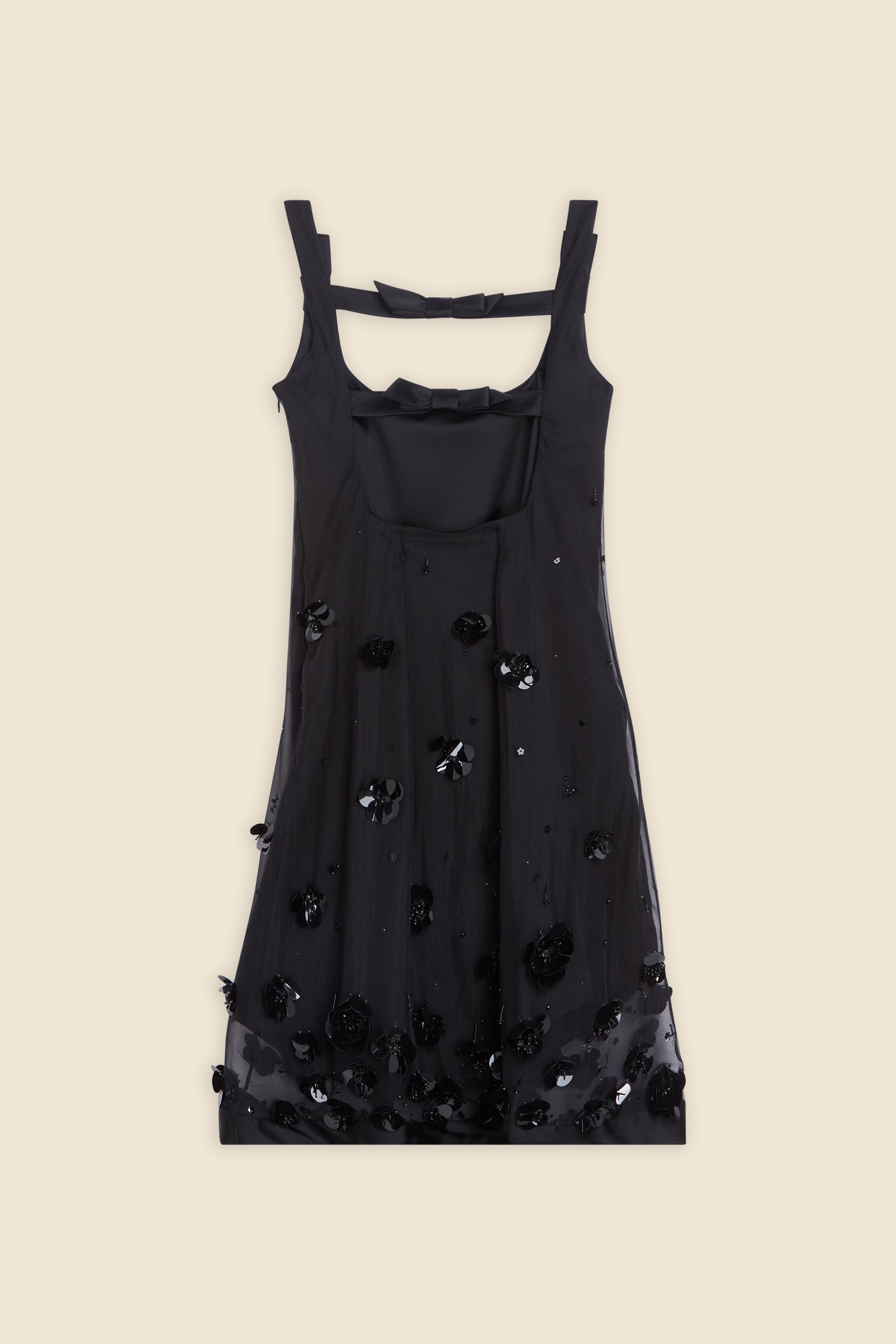 With hand-applied paillettes and crystals on silk organza featuring the satin edges, the dress transforms classic floral embroidery into a modern piece