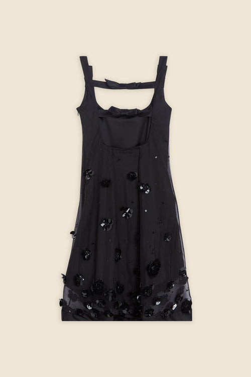 With hand-applied paillettes and crystals on silk organza featuring the satin edges, the dress transforms classic floral embroidery into a modern piece