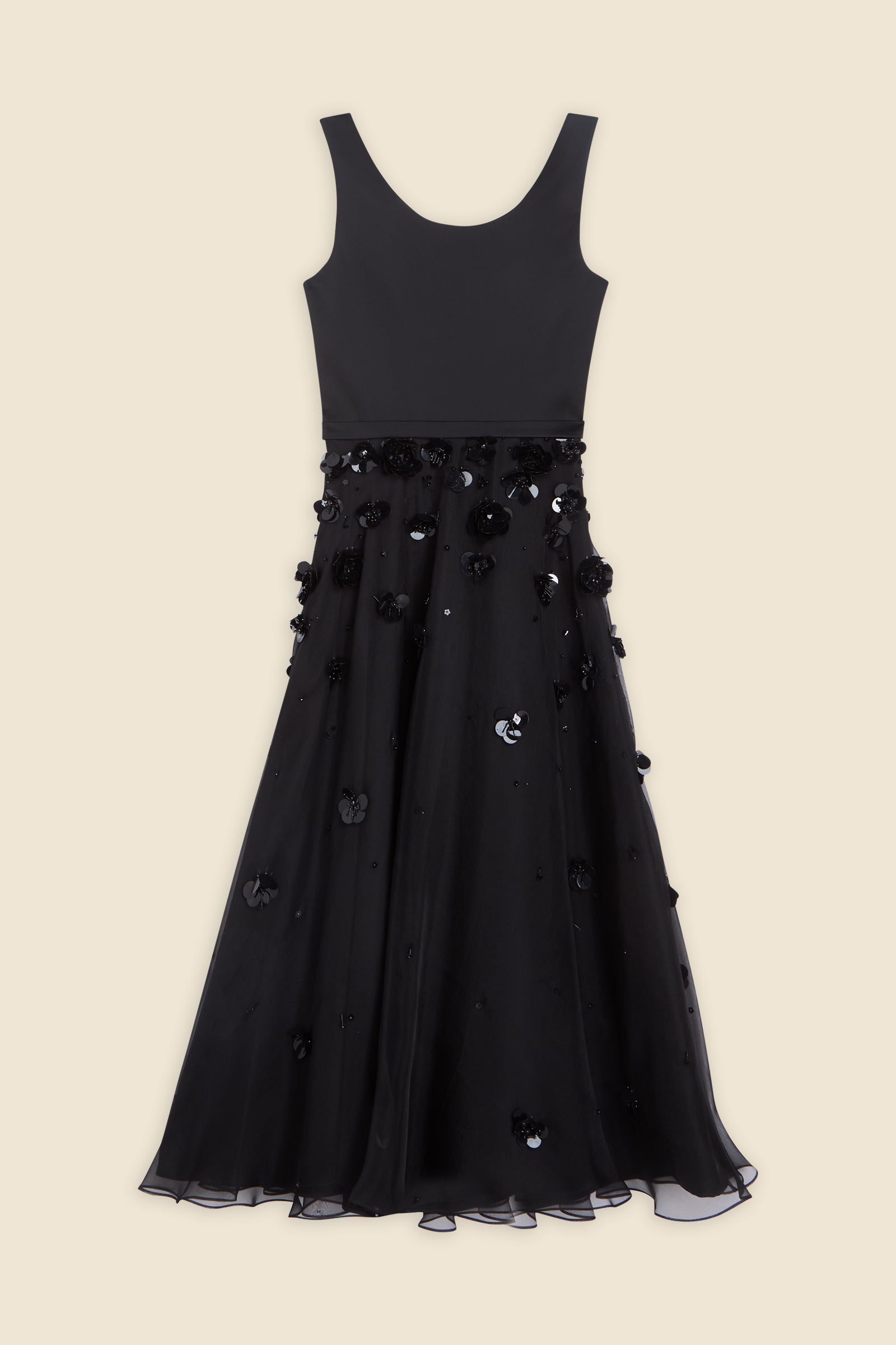 With hand-applied paillettes and crystals on silk organza featuring the satin edges, the dress transforms classic floral embroidery into a modern piece