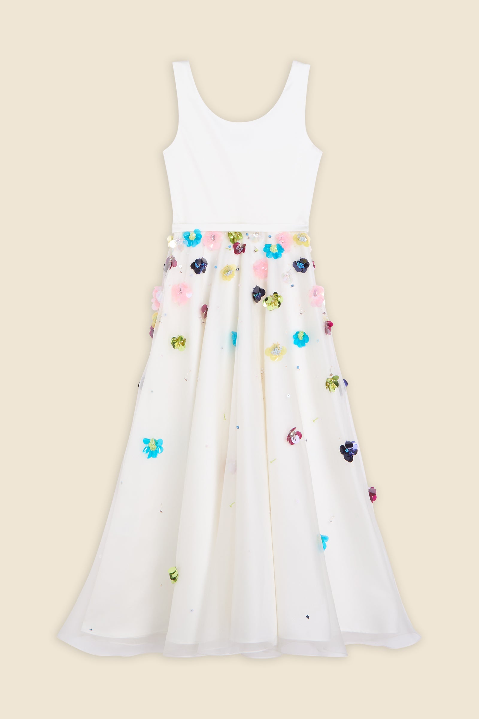 With hand-applied paillettes and crystals on silk organza featuring the satin edges, the dress transforms classic floral embroidery into a modern piece