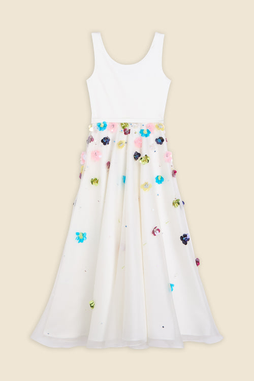 With hand-applied paillettes and crystals on silk organza featuring the satin edges, the dress transforms classic floral embroidery into a modern piece