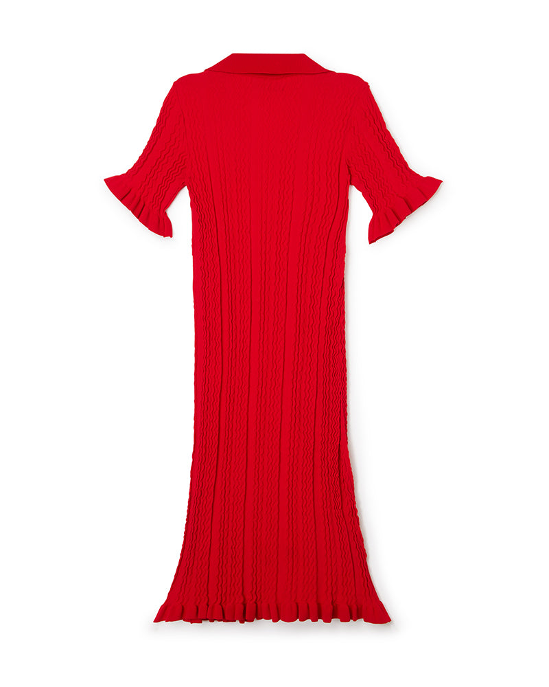 Red knit dress with flowing vertical ribbed texture, featuring flared sleeves and a collared neckline.
