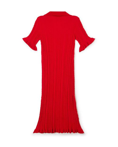 Red knit dress with flowing vertical ribbed texture, featuring flared sleeves and a collared neckline.