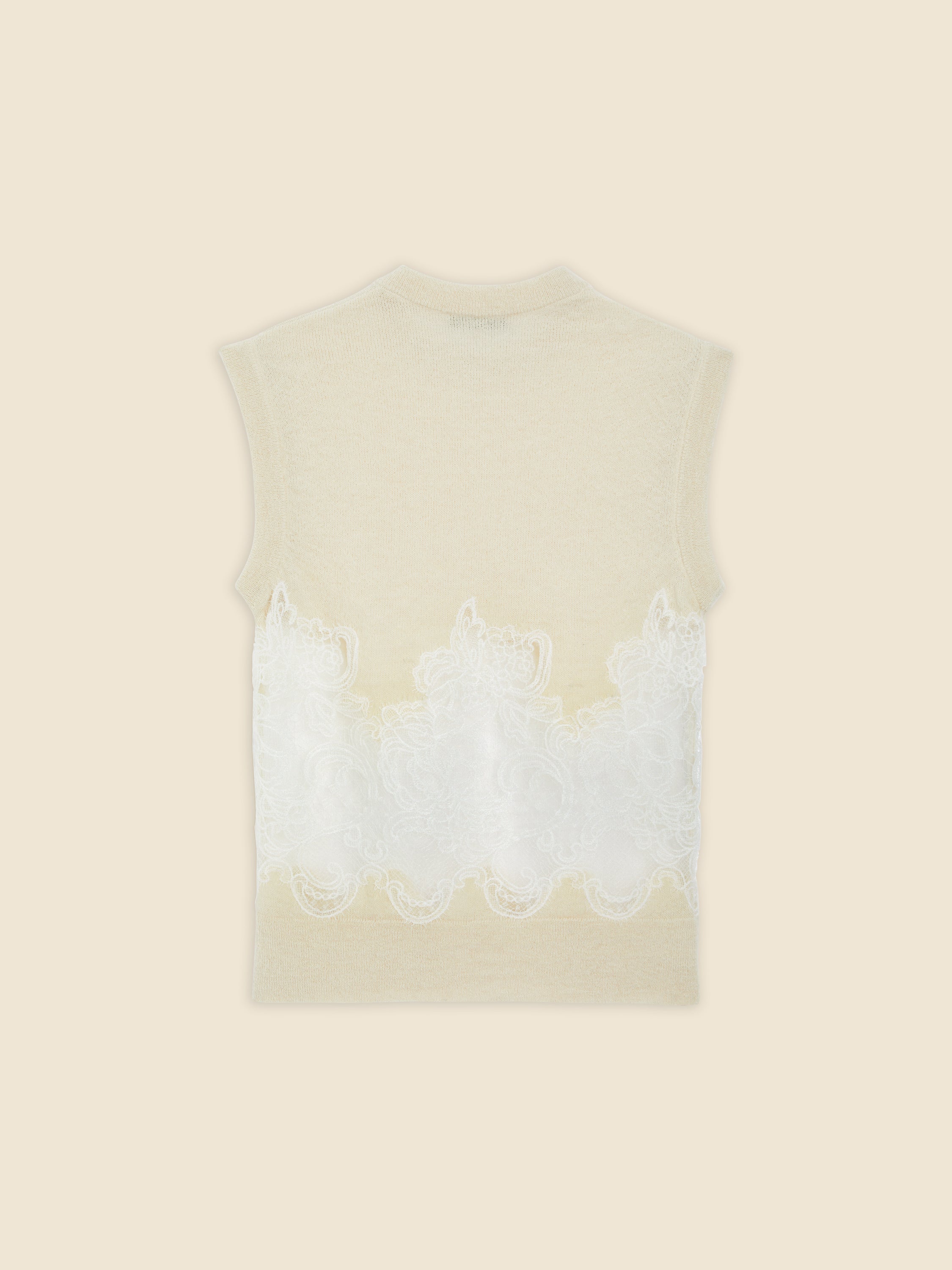 Sleeveless top in soft beige wool with intricate white lace detailing, offering a delicate and elegant design touch.