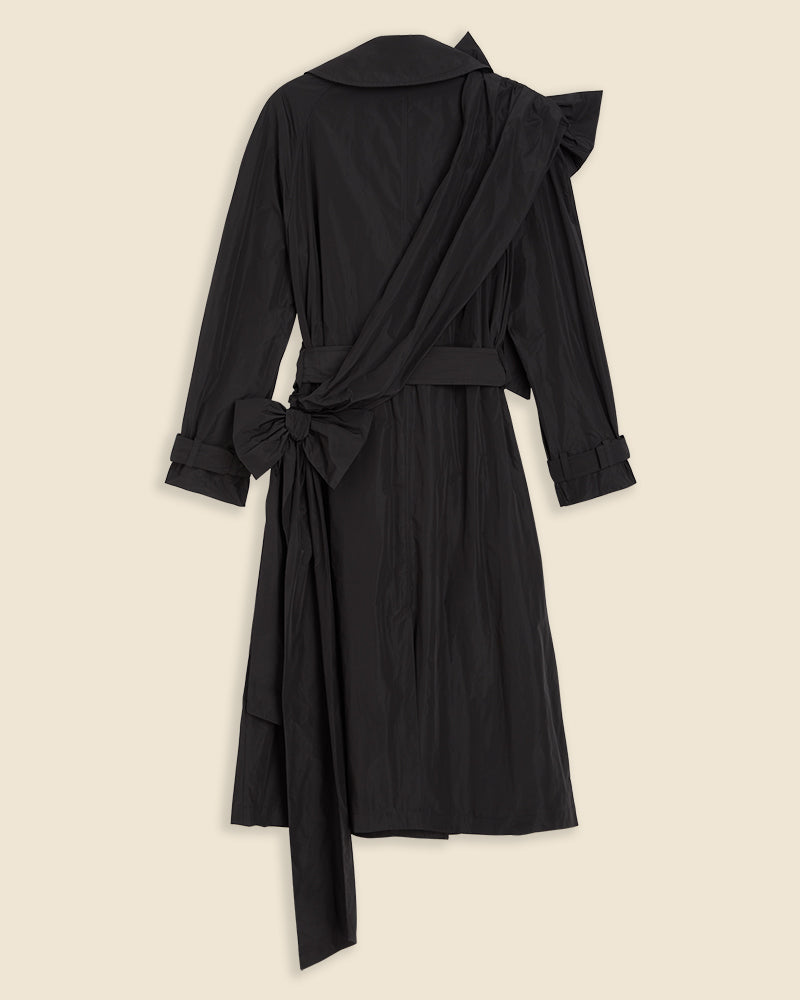 Elegant black trench coat with stylized ruffled collar and statement bow at the waist, exuding sophistication and chic design.