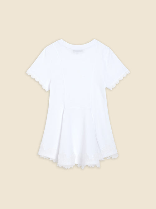 White cotton t-shirt with delicate lace trim on sleeves and hem, featuring a soft, flowing A-line silhouette.
