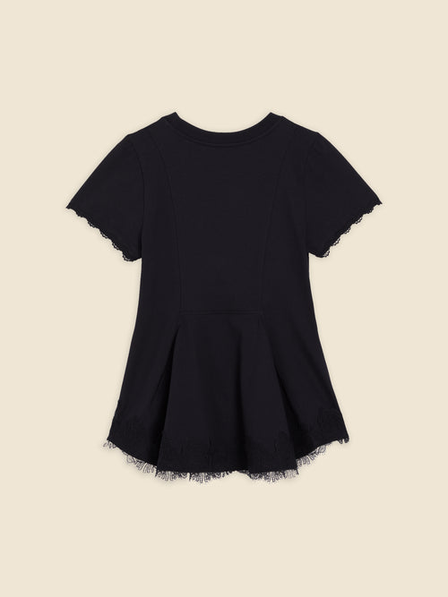 Black short-sleeve dress with intricate lace trim on the hem, featuring a flared silhouette on a soft cotton fabric.