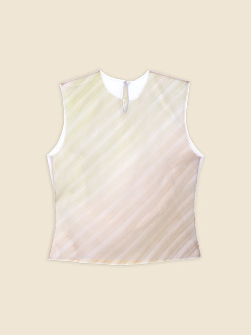 Cream and light sage sleeveless top with subtle diagonal stripes, featuring a buttoned loop closure on a plain background.