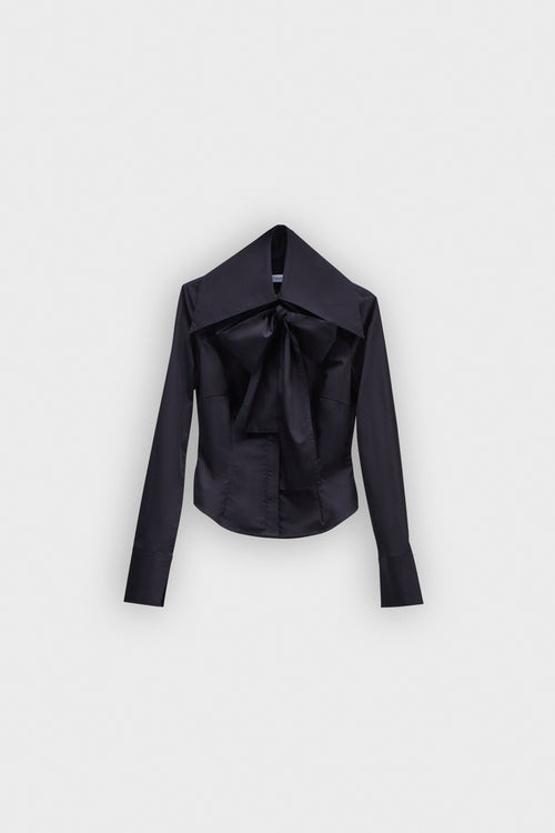 A black long sleeve shirt with a bow on the collar on a white background.