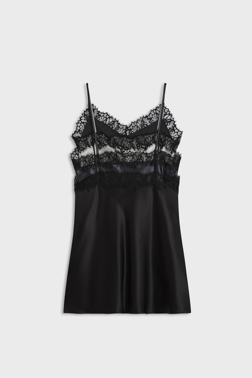 A black satin slip dress with delicate black lace trim at the neckline and thin spaghetti straps, shown flat on a light gray background.