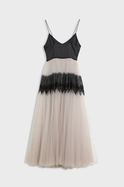 A sleeveless midi dress with a black spaghetti-strap bodice, a sheer beige tulle skirt, and a black lace ruffle band at the waist, shown against a light gray background.