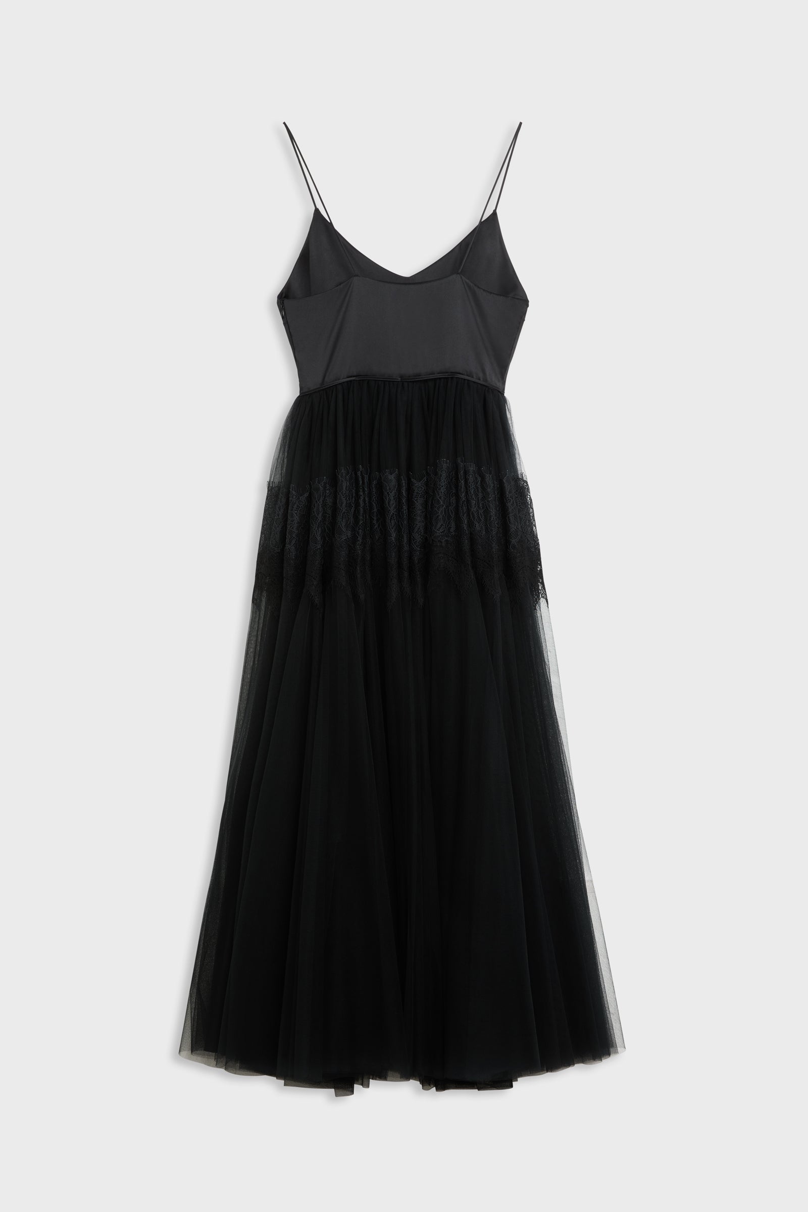 Black dress shot from the back with tulle and lace skirt.