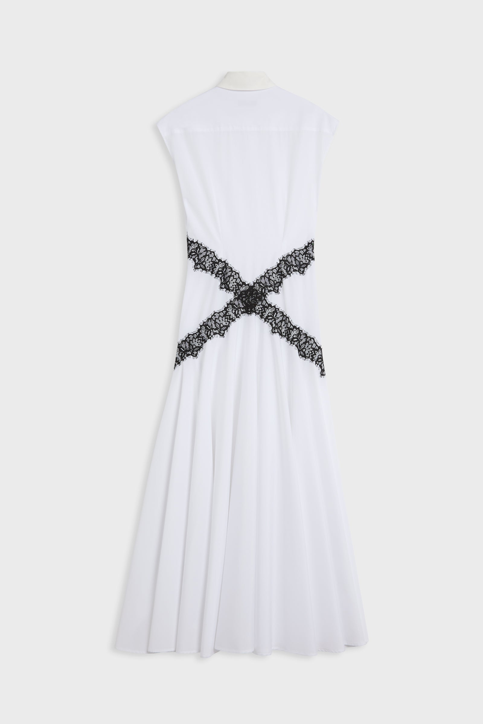 White sleeveless midi dress shown from the back, featuring a black lace criss-cross detail at the waist, displayed on a mannequin against a light gray background.
