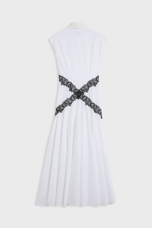 White sleeveless midi dress shown from the back, featuring a black lace criss-cross detail at the waist, displayed on a mannequin against a light gray background.