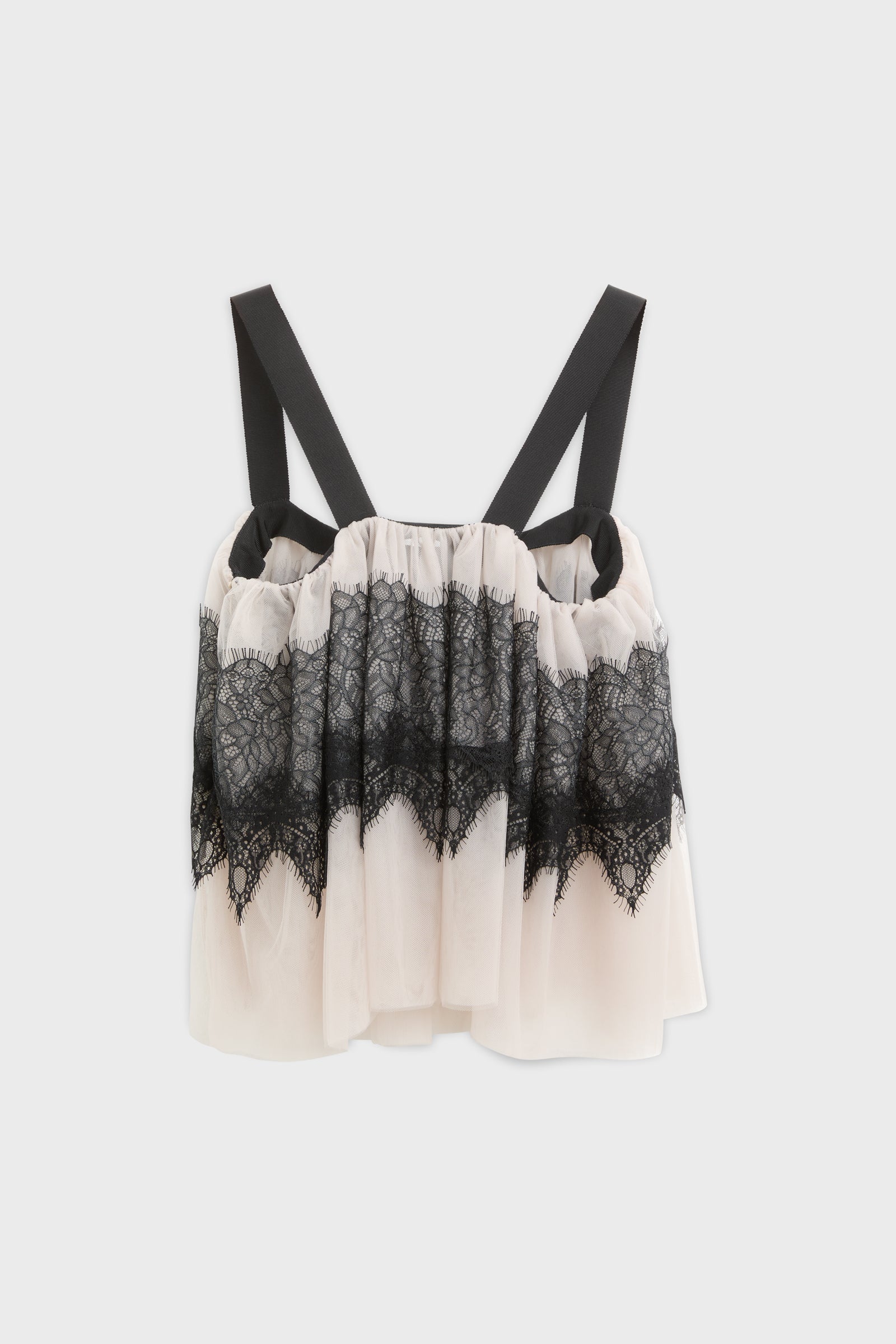 Top with lace and tulle and black strap shot from the back.
