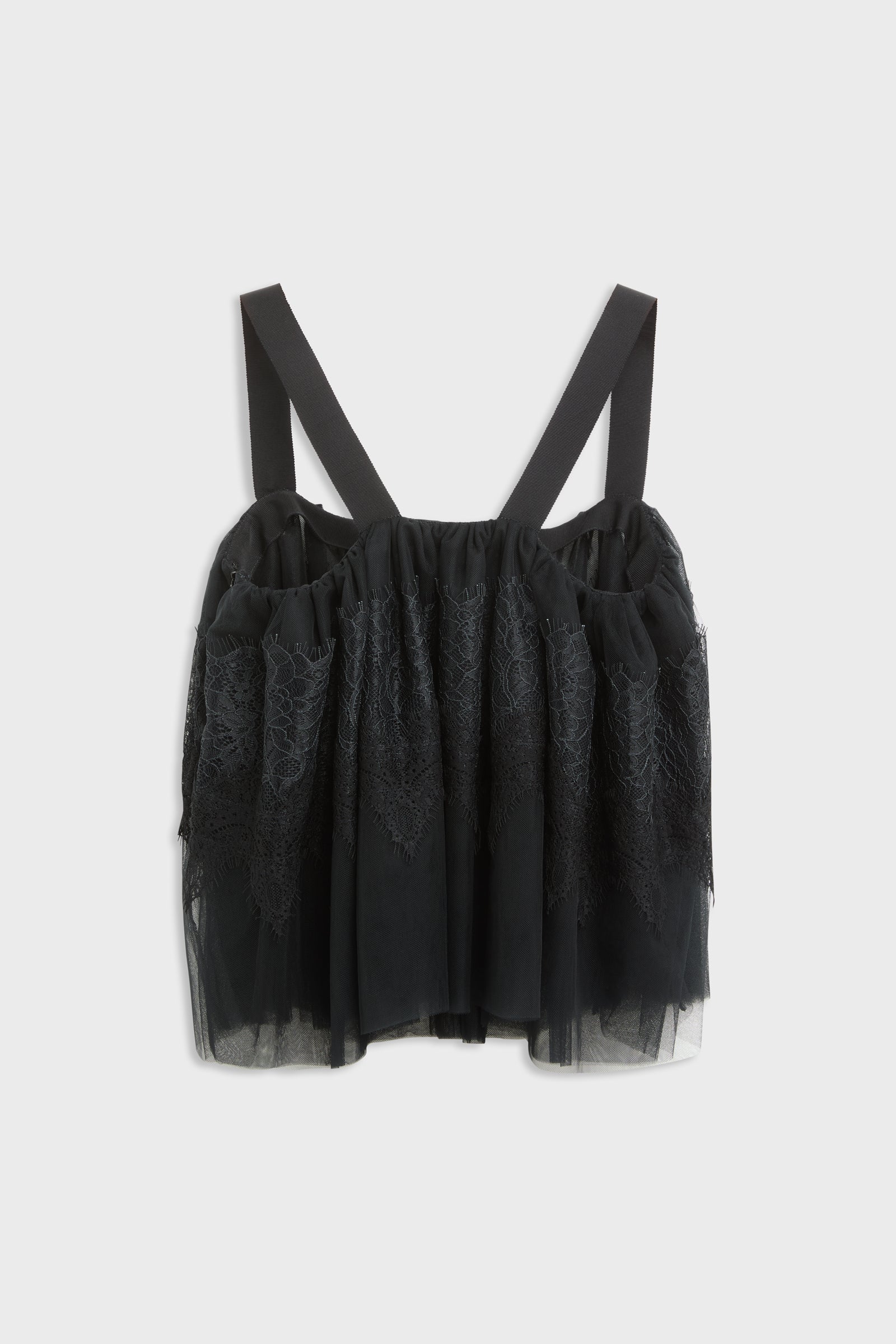 Black top with tulle and lace desing with straps shot from the back.