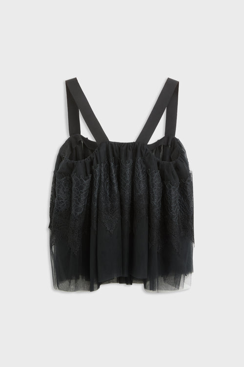 Black top with tulle and lace desing with straps shot from the back.