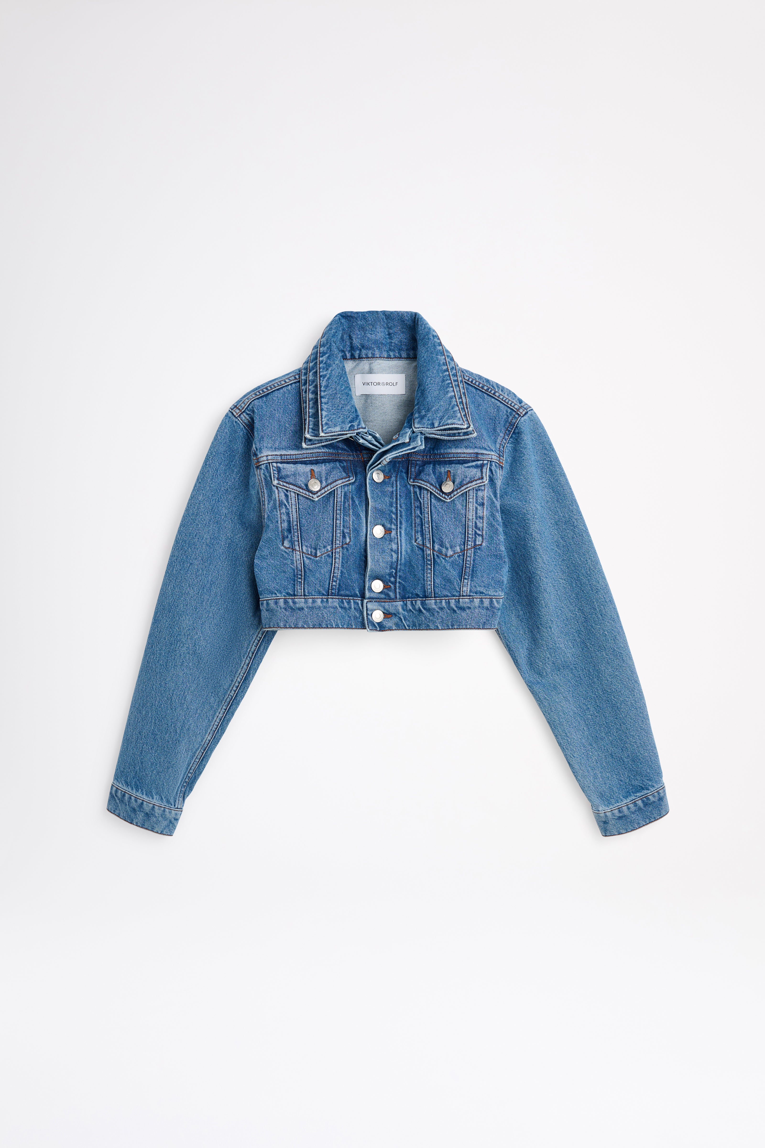 Blue denim jacket on a white background