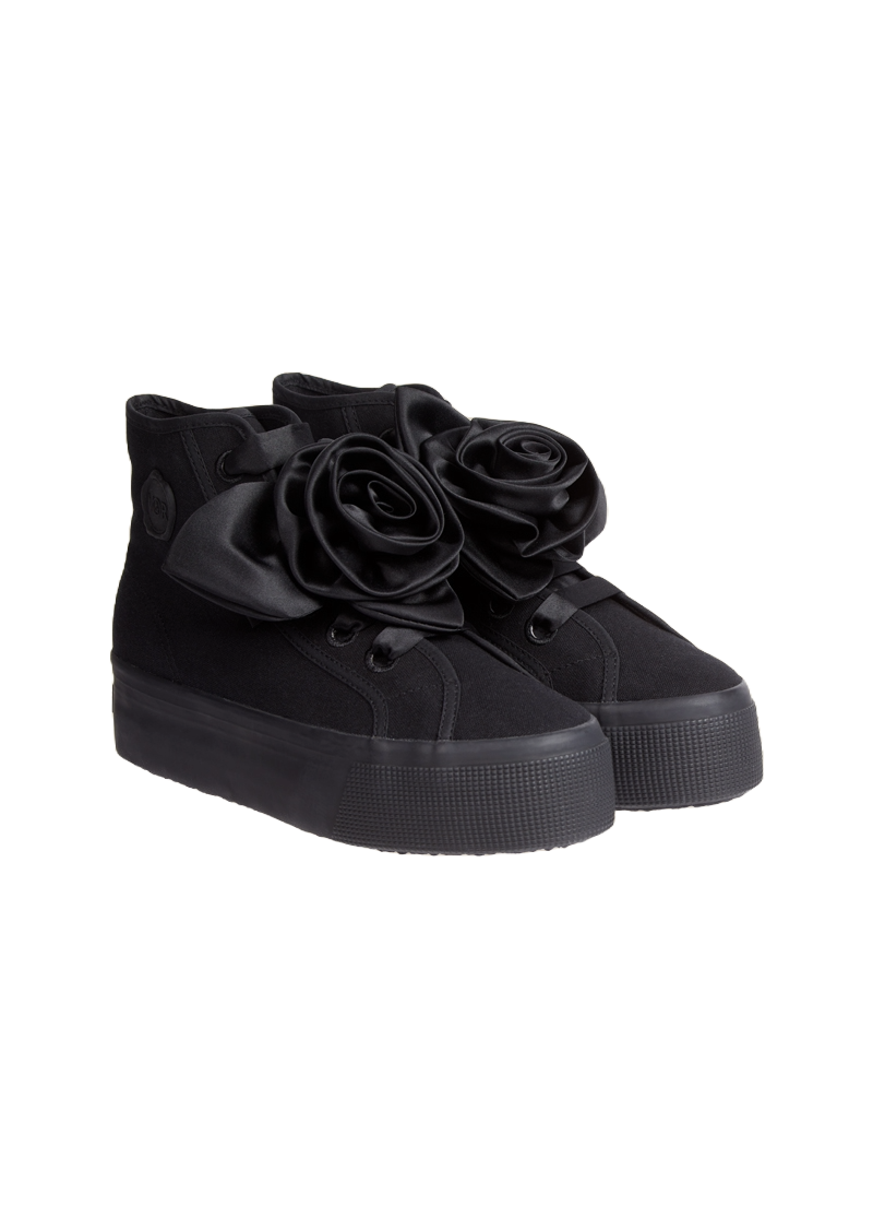 Black high-top sneakers featuring eye-catching satin rose embellishments on the sides, elevated by chunky rubber soles.