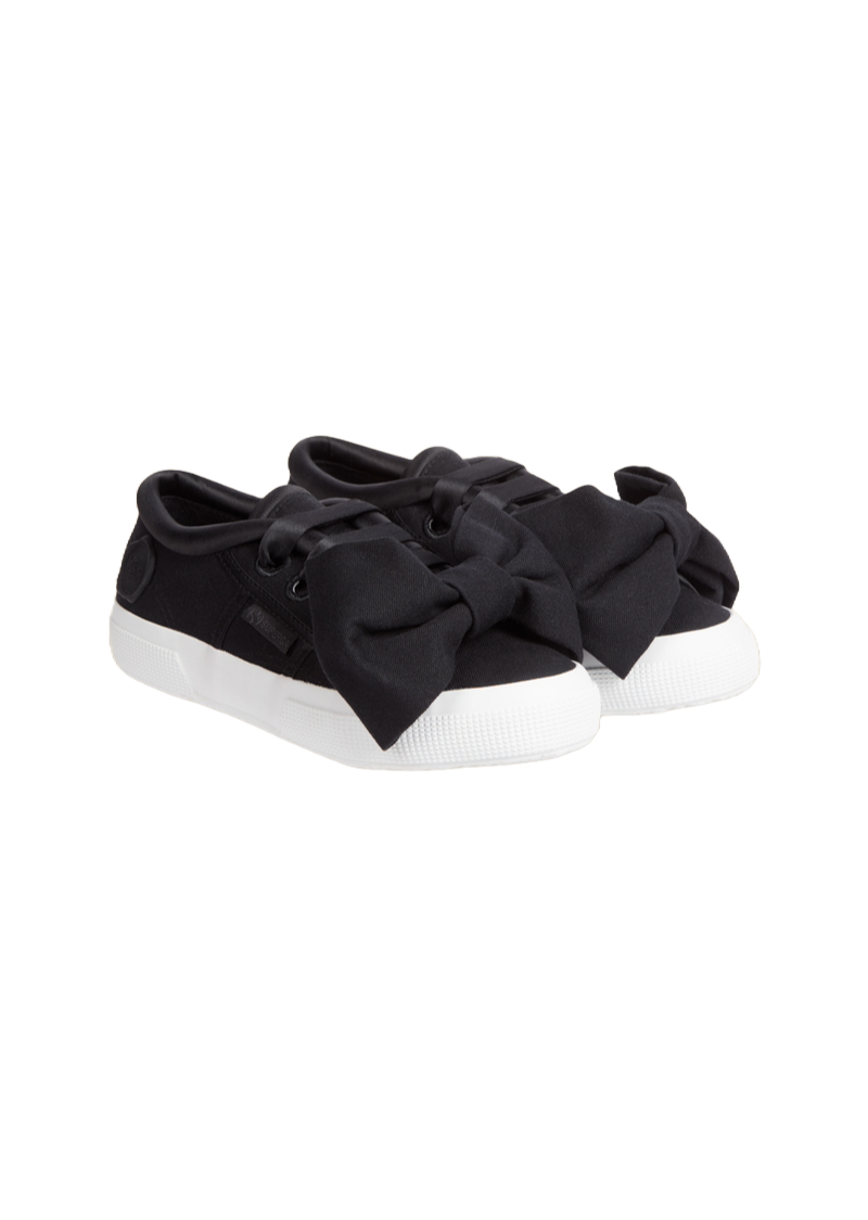 Stylish black canvas sneakers featuring oversized fabric bows, designed with classic white rubber soles for a chic look.