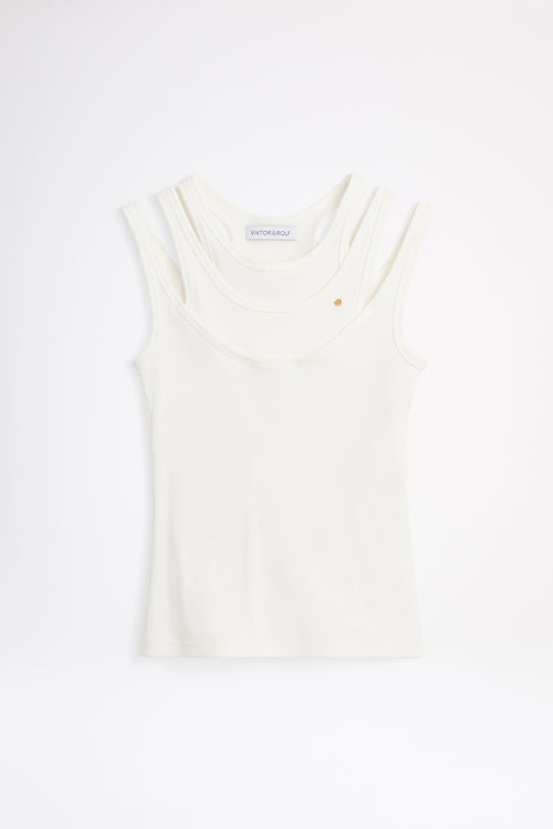 White sleeveless top on a light gray background