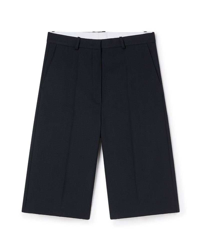 Black tailored wide-leg shorts featuring crisp creases and a smooth waistband, ideal for a sophisticated, minimalist look.