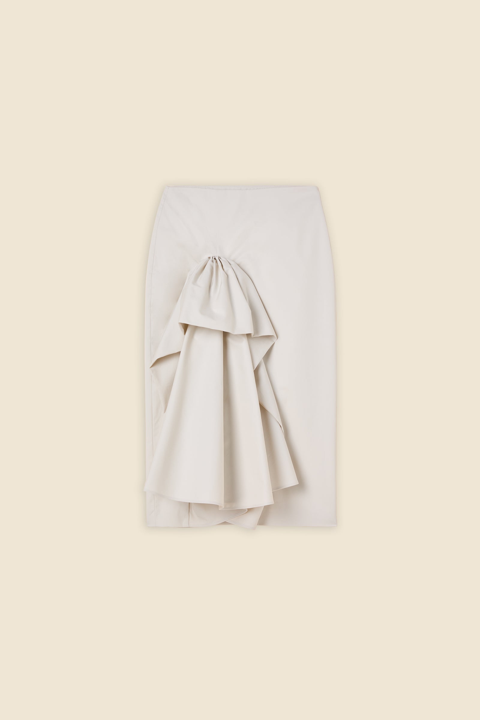 The craftmanship of the skirt reinterprets classic haute couture tuck ups into a modern silhouette from gabardine