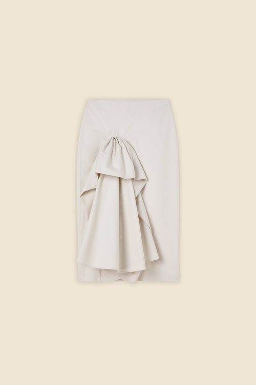 The craftmanship of the skirt reinterprets classic haute couture tuck ups into a modern silhouette from gabardine