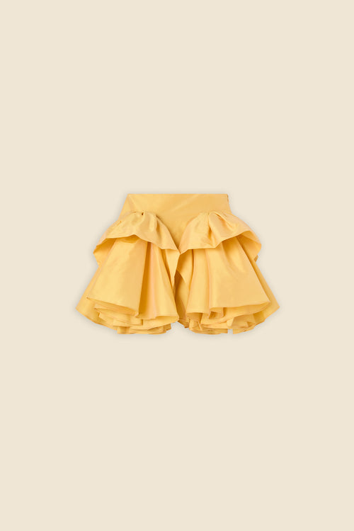 The craftmanship of the skirt reinterprets classic haute couture tuck ups into a modern silhouette from silk-blend taffeta