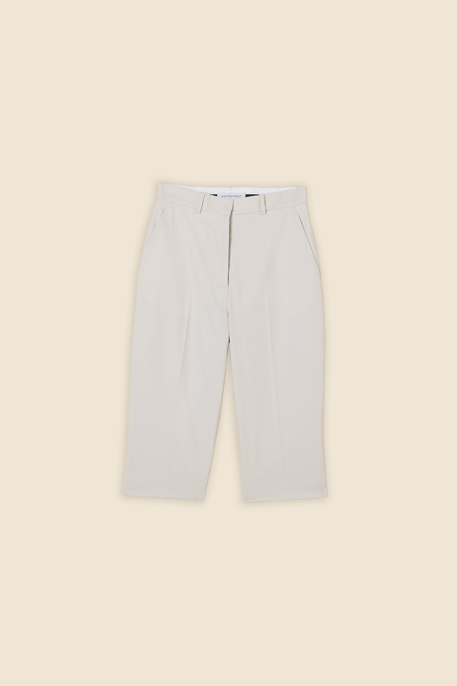 Crafted from gabardine, the high-waisted capri pants offer a tailored fit and timeless elegance