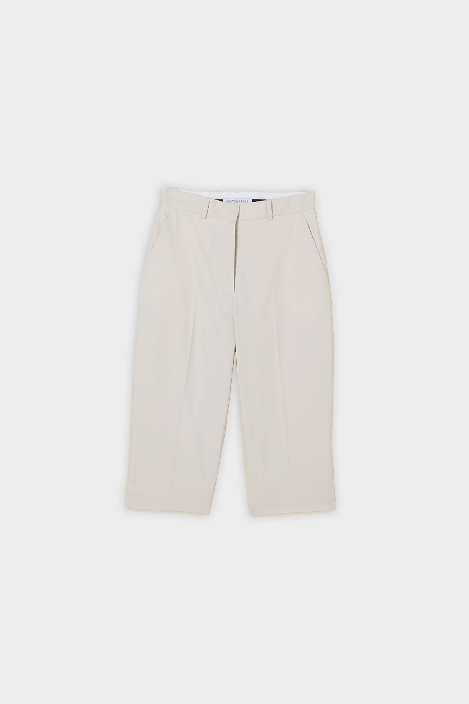 Grey capri pants on a white background.