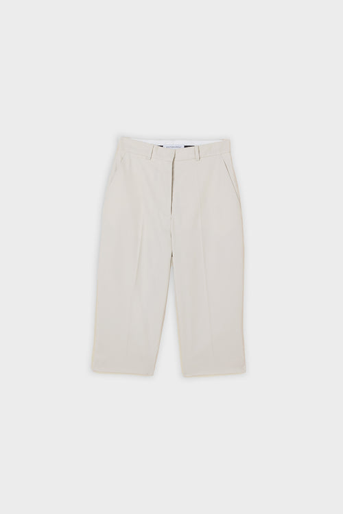 Grey capri pants on a white background.