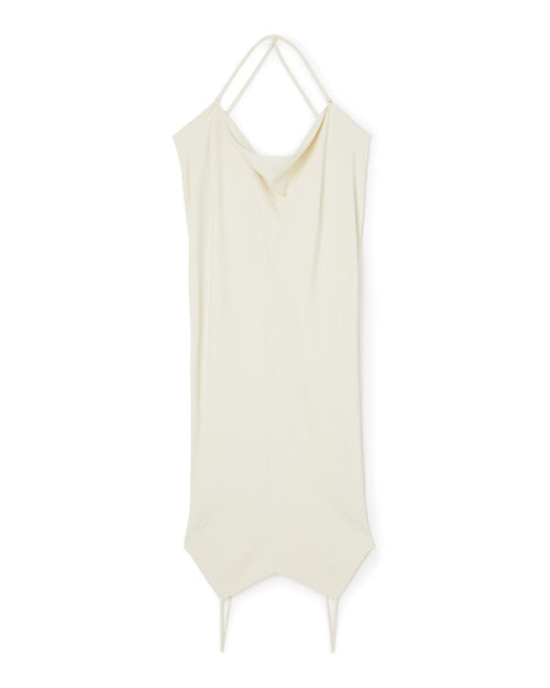 Elegant cream draped halter dress featuring a minimalist design and sharp asymmetric hemline, perfect for summer occasions.
