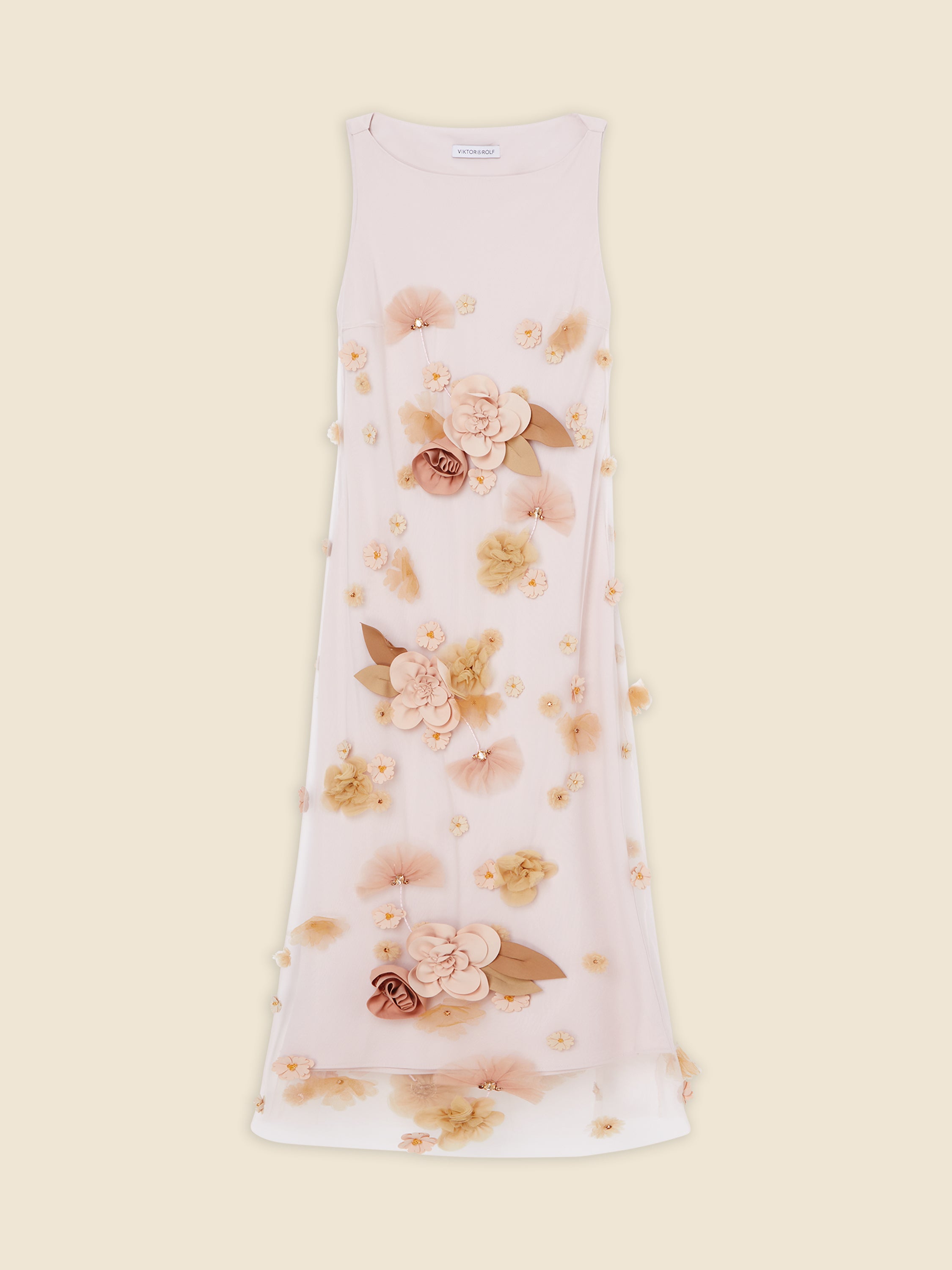 Sleeveless cream dress adorned with 3D floral appliqués and delicate fabric petals, offering an elegant and whimsical style.