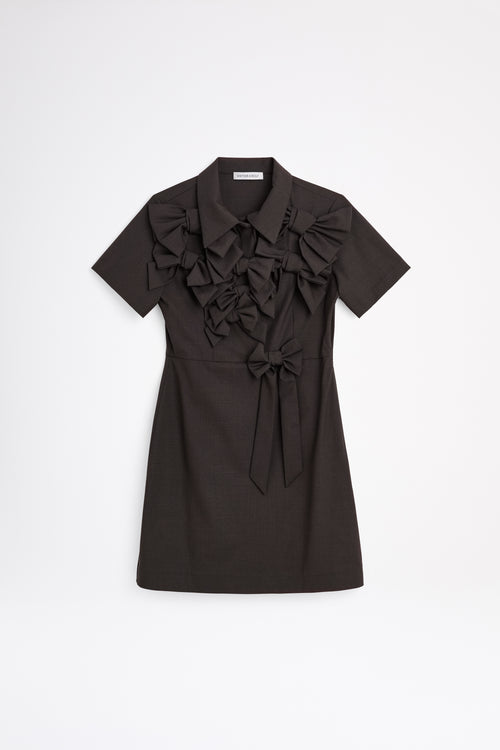 The wool dress features the seasonal bow bouquet technique, where timeless elegance meets refined craftsmanship in a seamless fusion of sophistication and grace