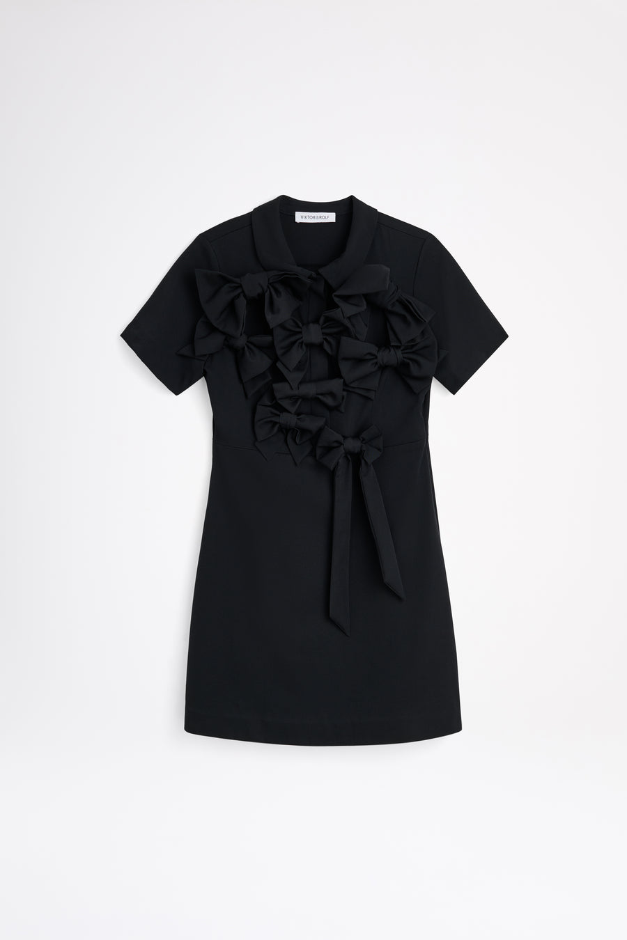 The wool dress features the seasonal bow bouquet technique, where timeless elegance meets refined craftsmanship in a seamless fusion of sophistication and grace