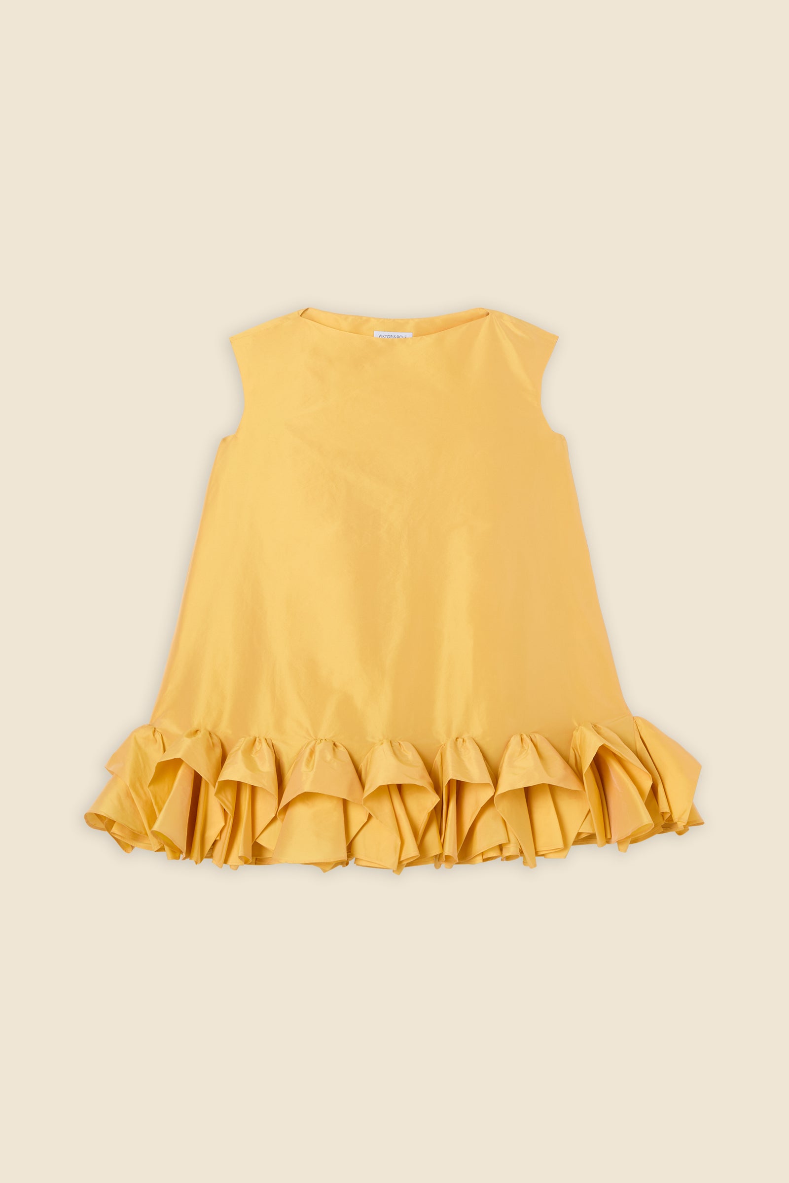 The craftmanship of the dress reinterprets classic haute couture tuck ups into a modern silhouette from silk-blend taffeta