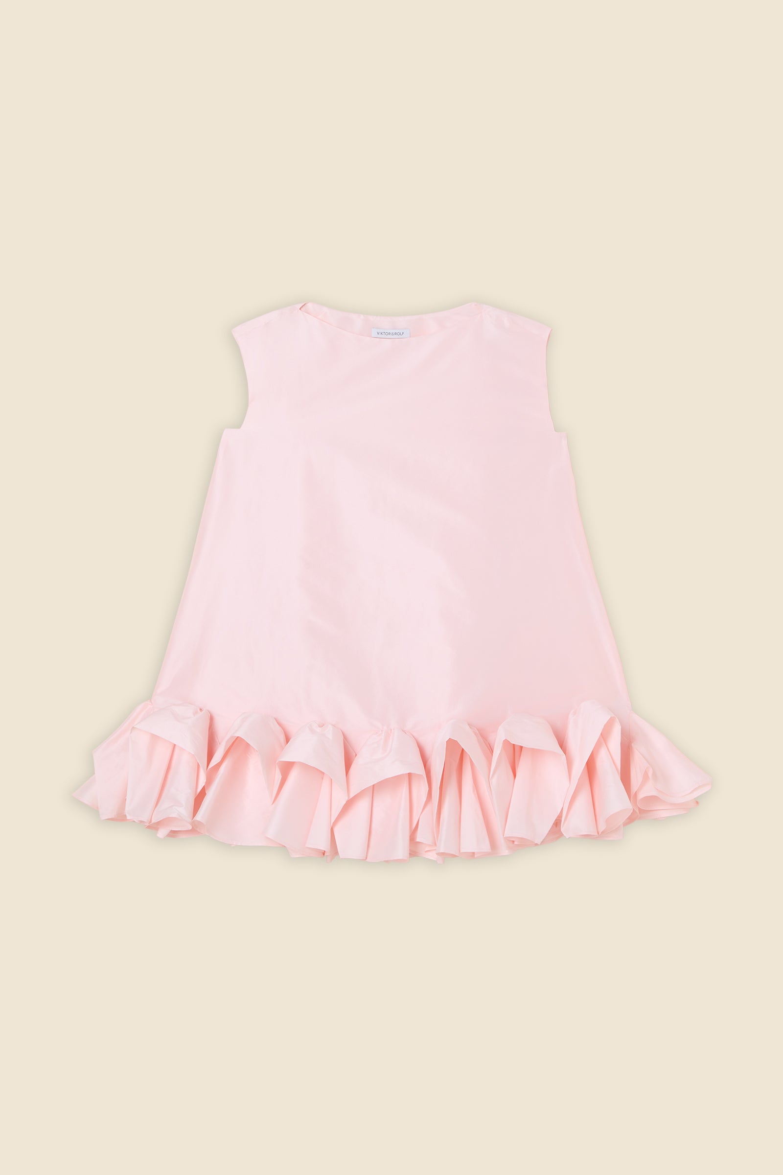 The craftmanship of the dress reinterprets classic haute couture tuck ups into a modern silhouette from silk-blend taffeta