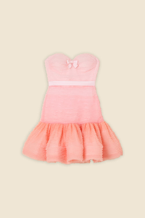 Inspired by the tulle from the ‘late stage capitalism waltz’ haute couture collection, the dress features hand crafted tulle ruffles for a feminine texture