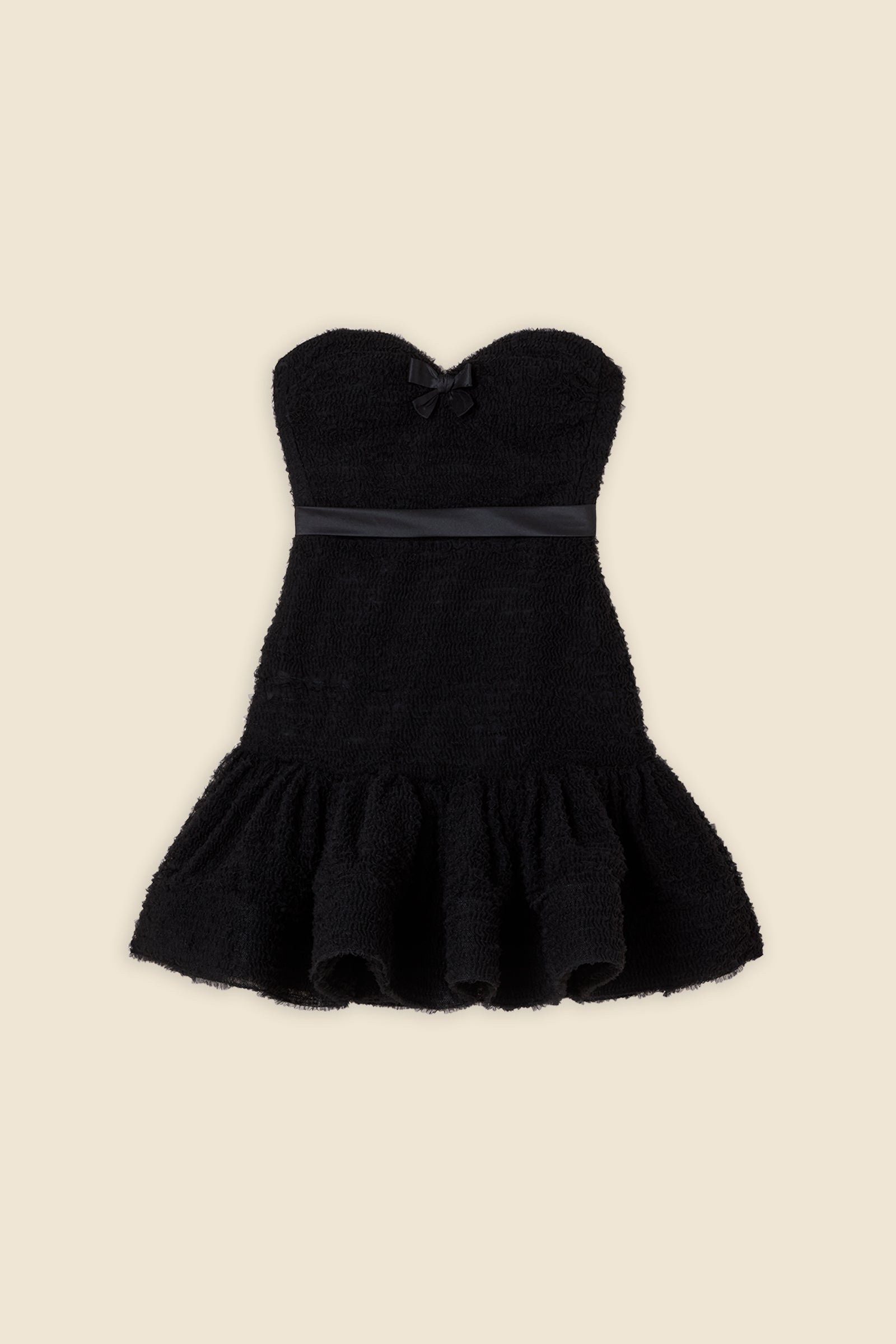 Inspired by the tulle from the ‘late stage capitalism waltz’ haute couture collection, the dress features hand crafted tulle ruffles for a feminine texture