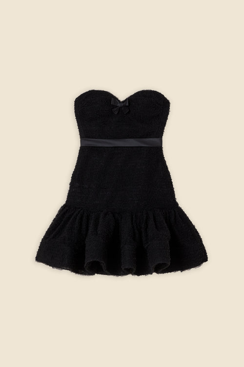 Inspired by the tulle from the ‘late stage capitalism waltz’ haute couture collection, the dress features hand crafted tulle ruffles for a feminine texture