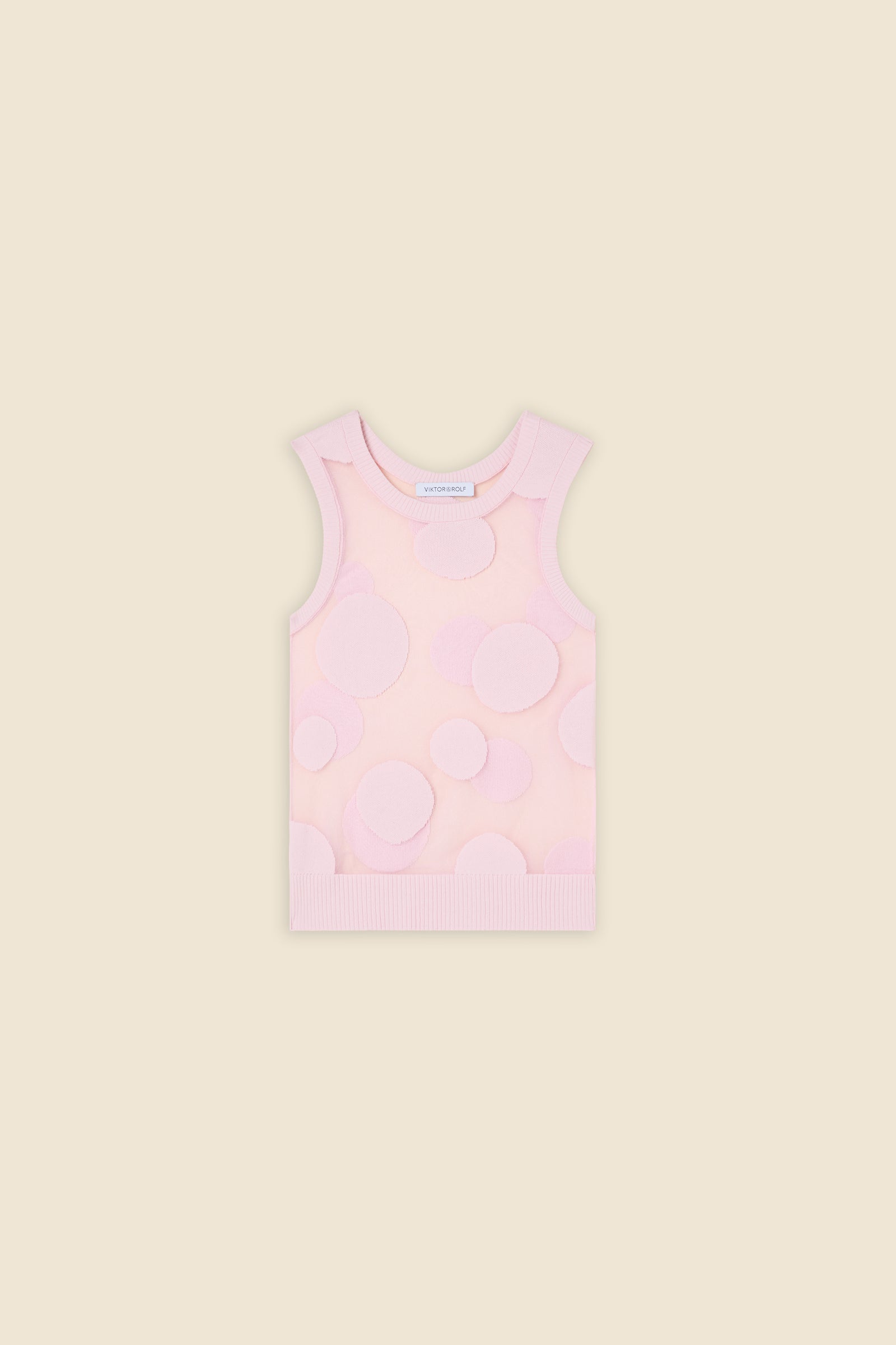 The classic pattern of the top is given a modern twist with intricate polka dot hole design on knit jacquard