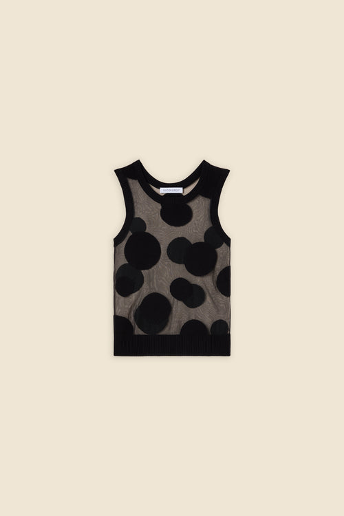 The classic pattern of the top is given a modern twist with intricate polka dot hole design on knit jacquard