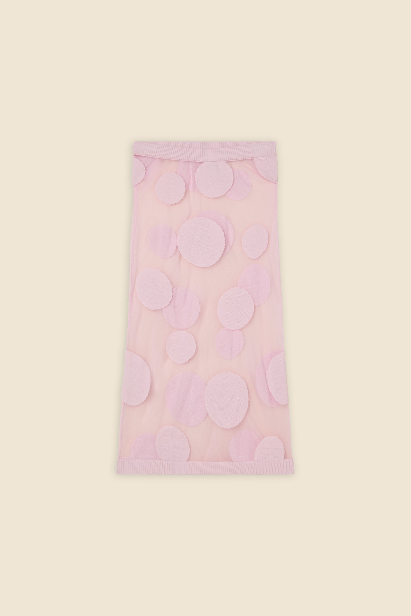 The classic pattern of the skirt is given a modern twist with intricate polka dot hole design on knit jacquard
