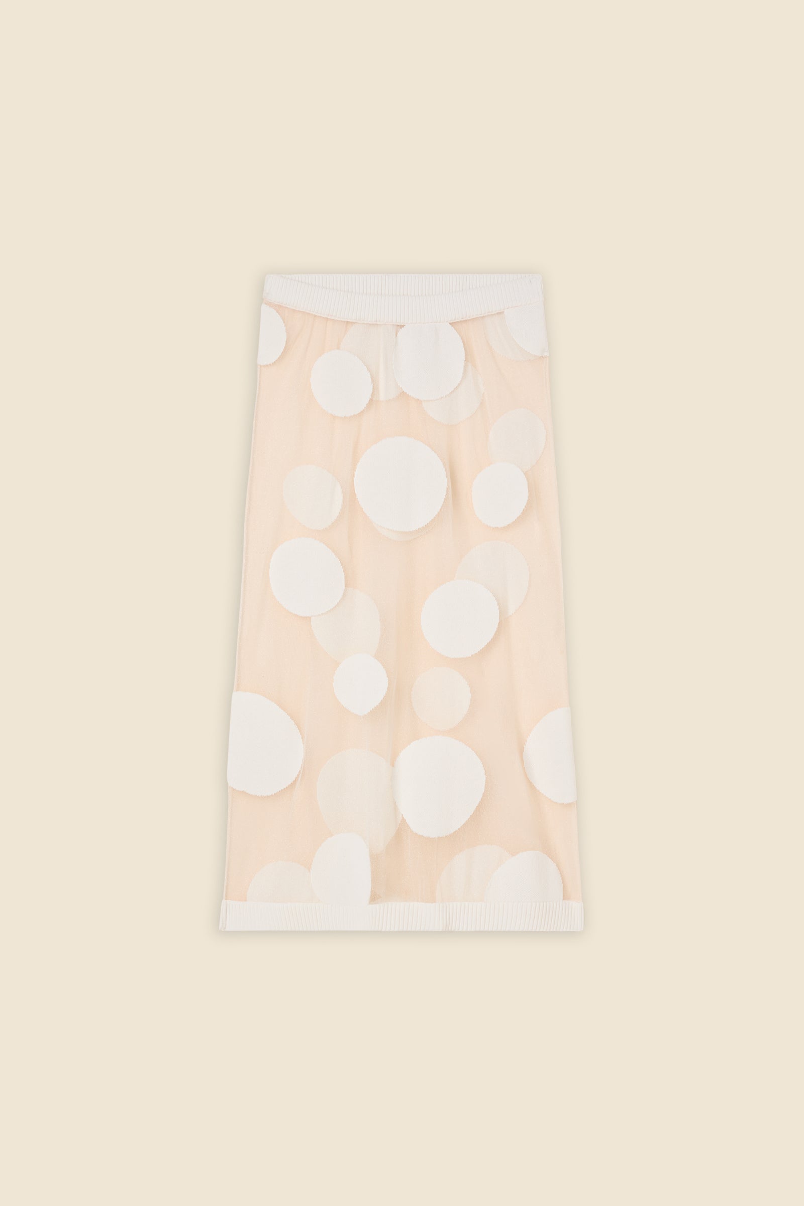 The classic pattern of the skirt is given a modern twist with intricate polka dot hole design on knit jacquard