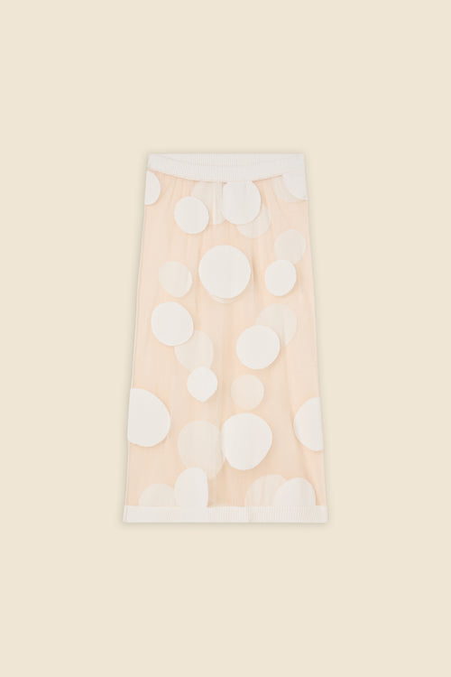 The classic pattern of the skirt is given a modern twist with intricate polka dot hole design on knit jacquard