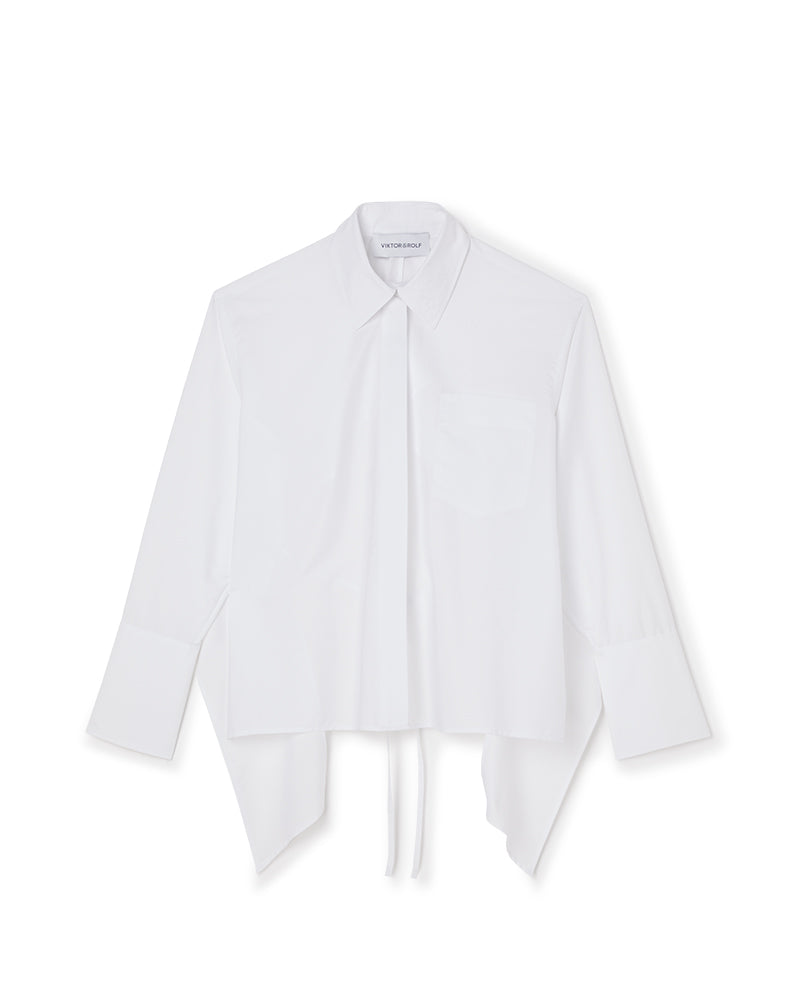 White asymmetric shirt with pointed collar and cuffed sleeves, featuring a modern, airy design style.